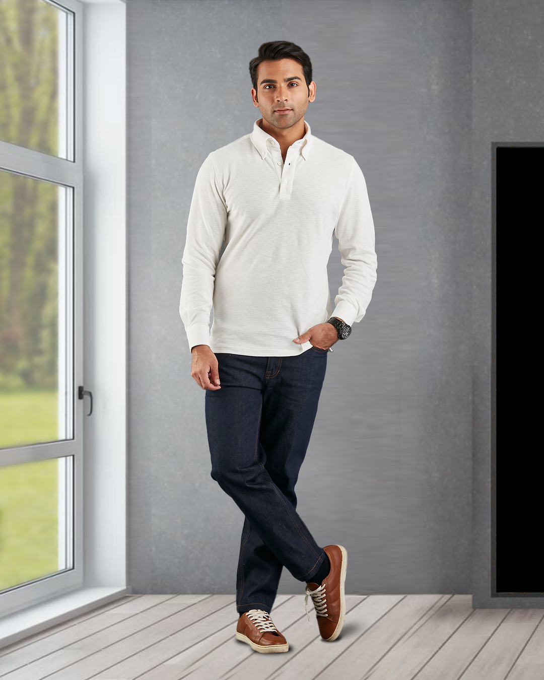 Model wearing the custom oxford polo shirt for men by Luxire in ivory white next to window