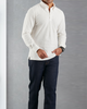 Model wearing the custom oxford polo shirt for men by Luxire in ivory white