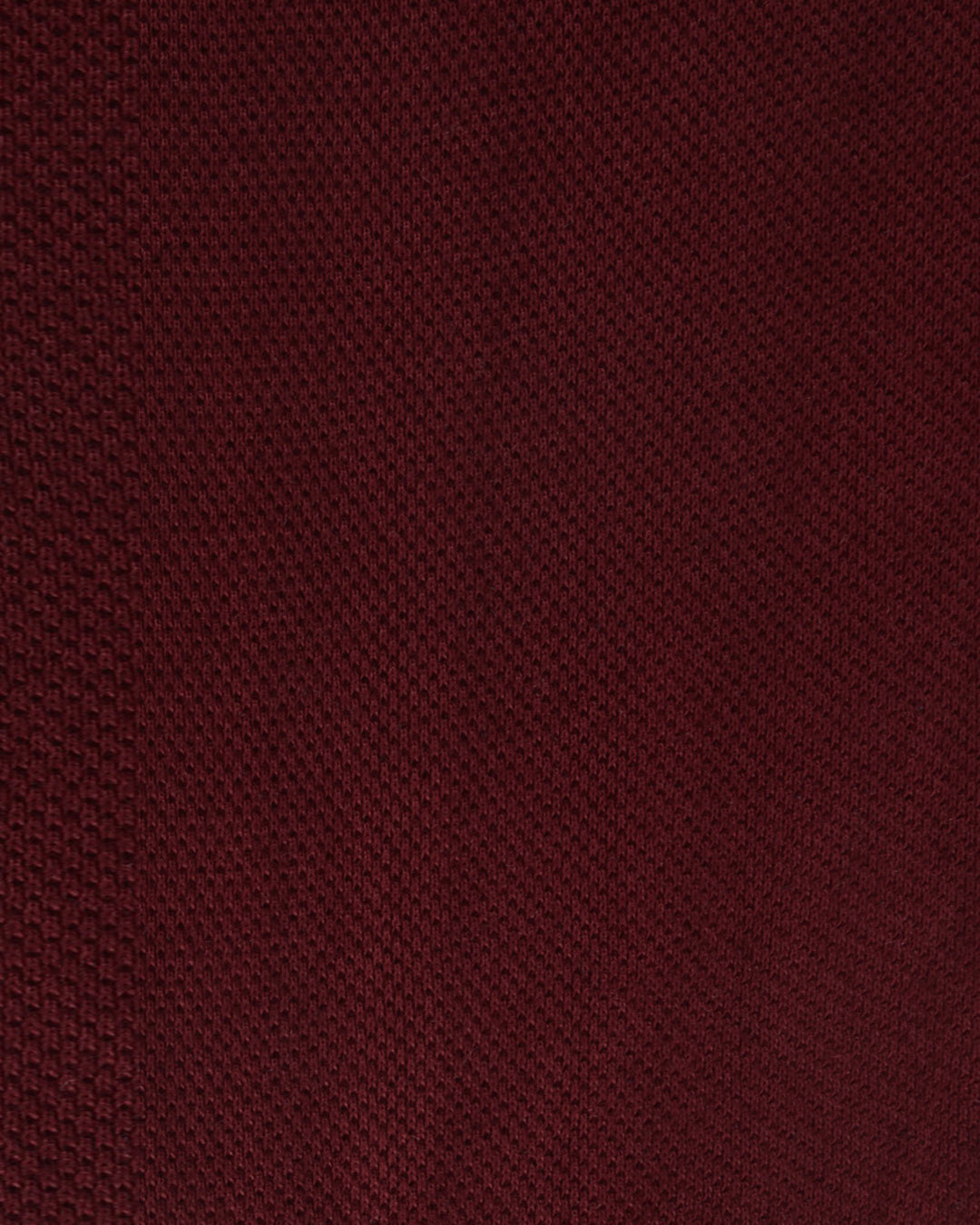 Close up of the custom oxford polo shirt for men by Luxire in maroon