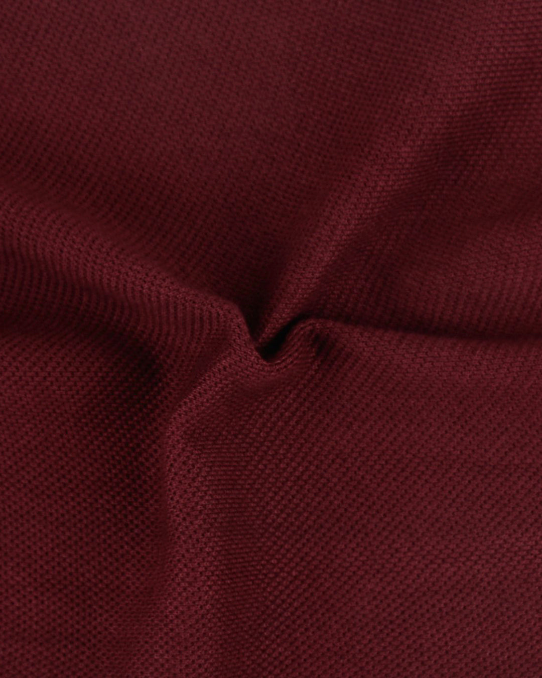 Close up fabric of the custom oxford polo shirt for men by Luxire in maroon
