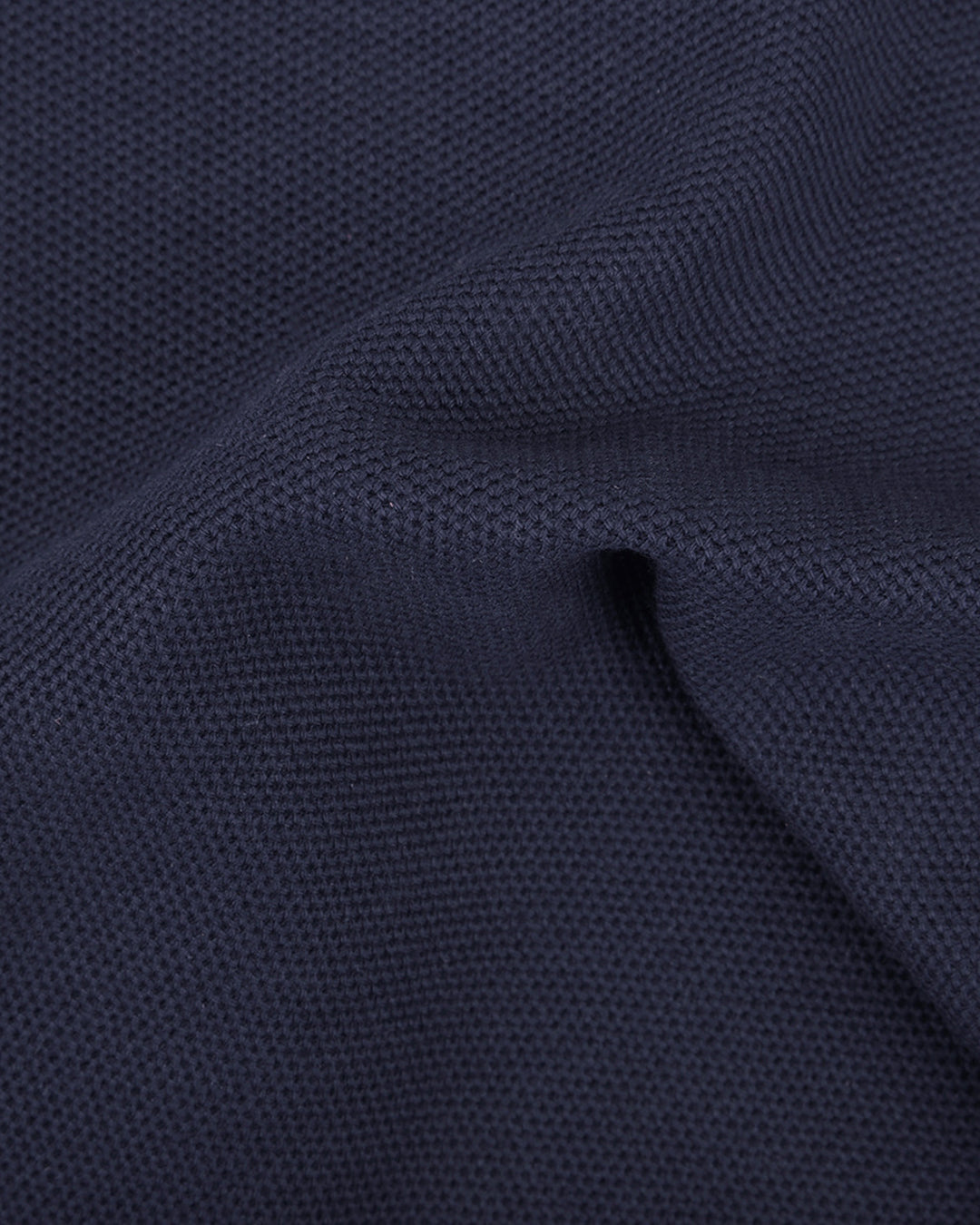 Close up of the custom oxford polo shirt for men by Luxire in midnight blue
