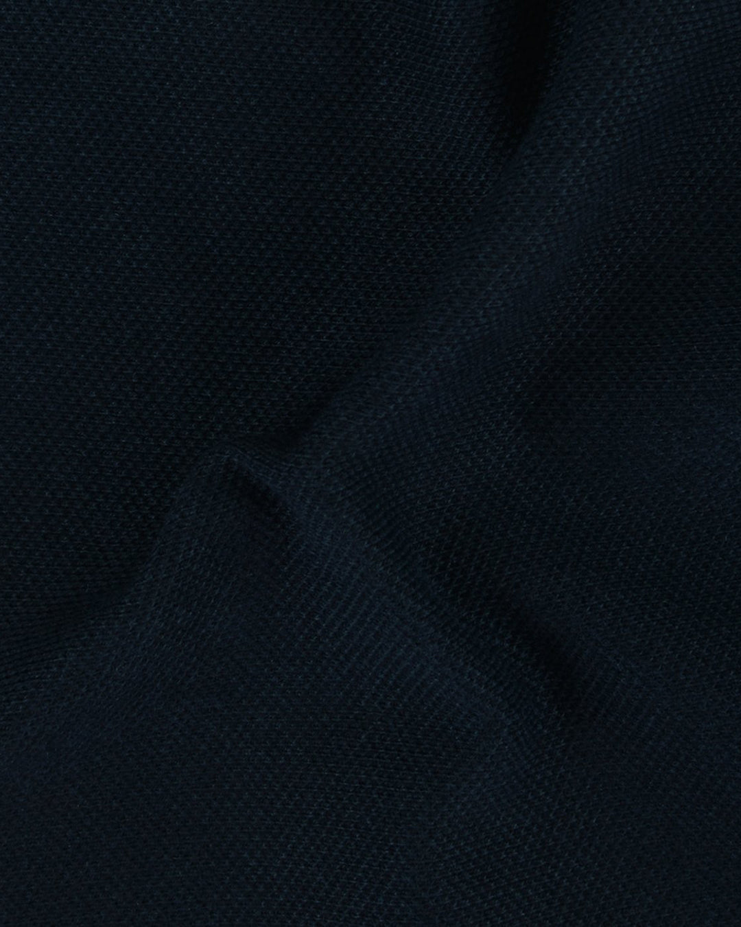 Close up fabric of the custom oxford polo shirt for men by Luxire in soft midnight blue