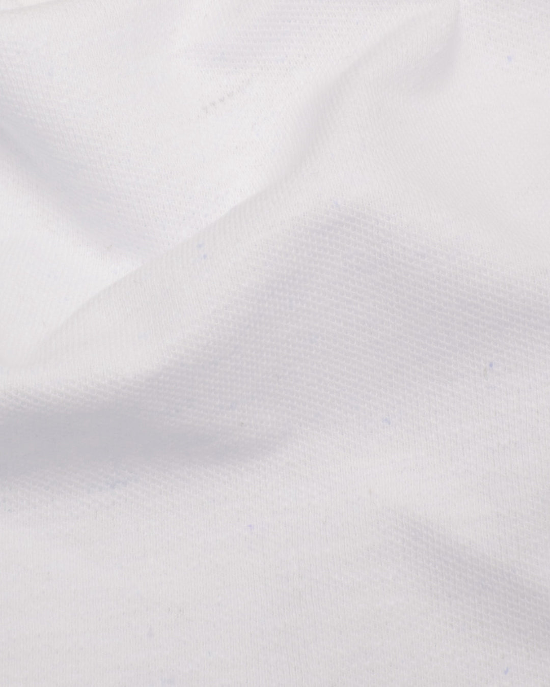 Close up of the custom oxford polo shirt for men by Luxire in pure white