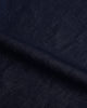 Close up view of custom linen cotton jeans for men by Luxire in indigo 2