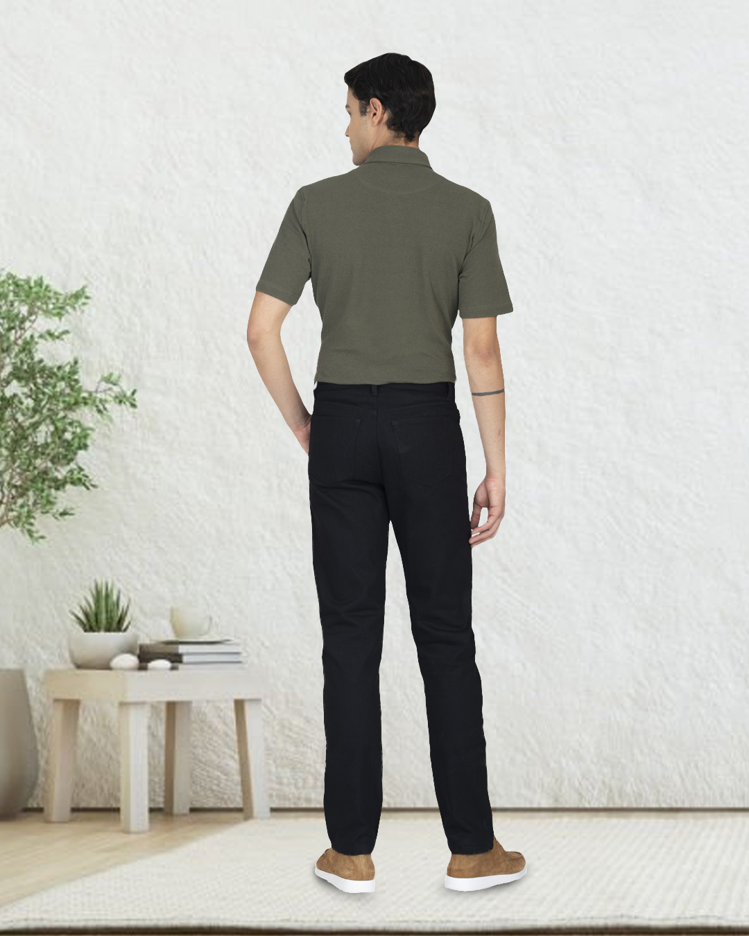 Back of model wearing custom overdyed jeans for men by Luxire in black 2