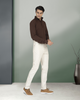 Model wearing melange denim jeans for men by Luxire in ivory