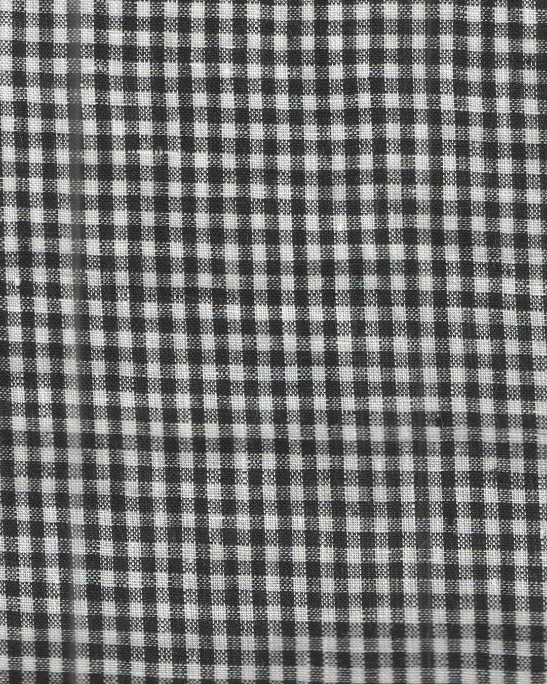 Close up view of custom linen shirt for men in black and white gingham