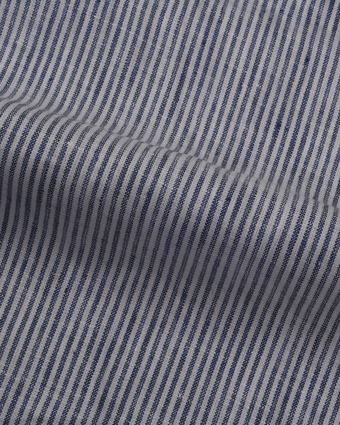 Close up of the custom linen shirt for men in blue and white stripes by Luxire Clothing