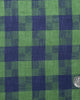 Close up view of custom linen shirt for men in indigo blue green madras gingham