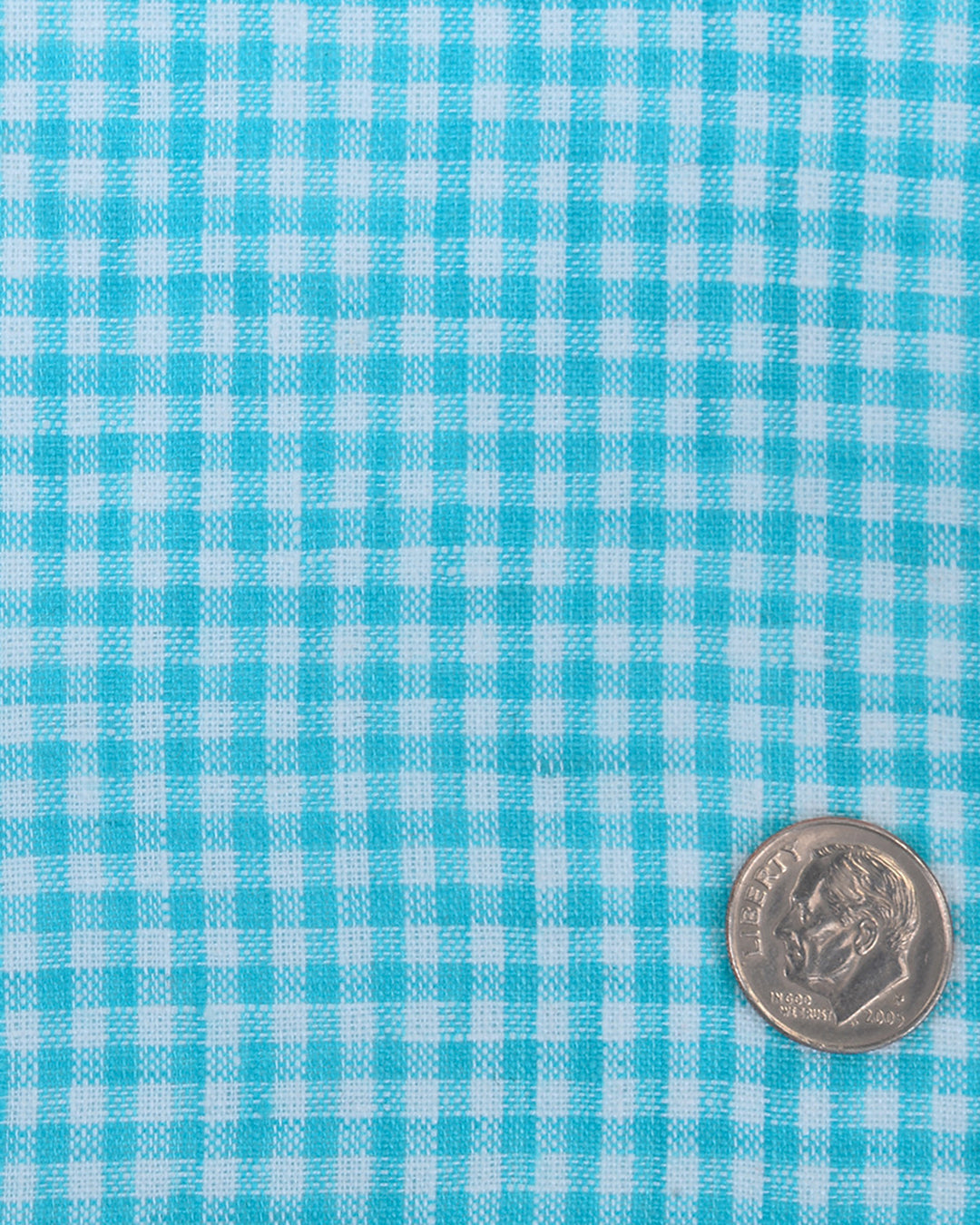 Close up of the custom linen shirt for men in light blue with white checks by Luxire Clothing