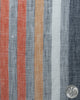 Close up of custom linen shirt for men in orange red white stripes by Luxire Clothing