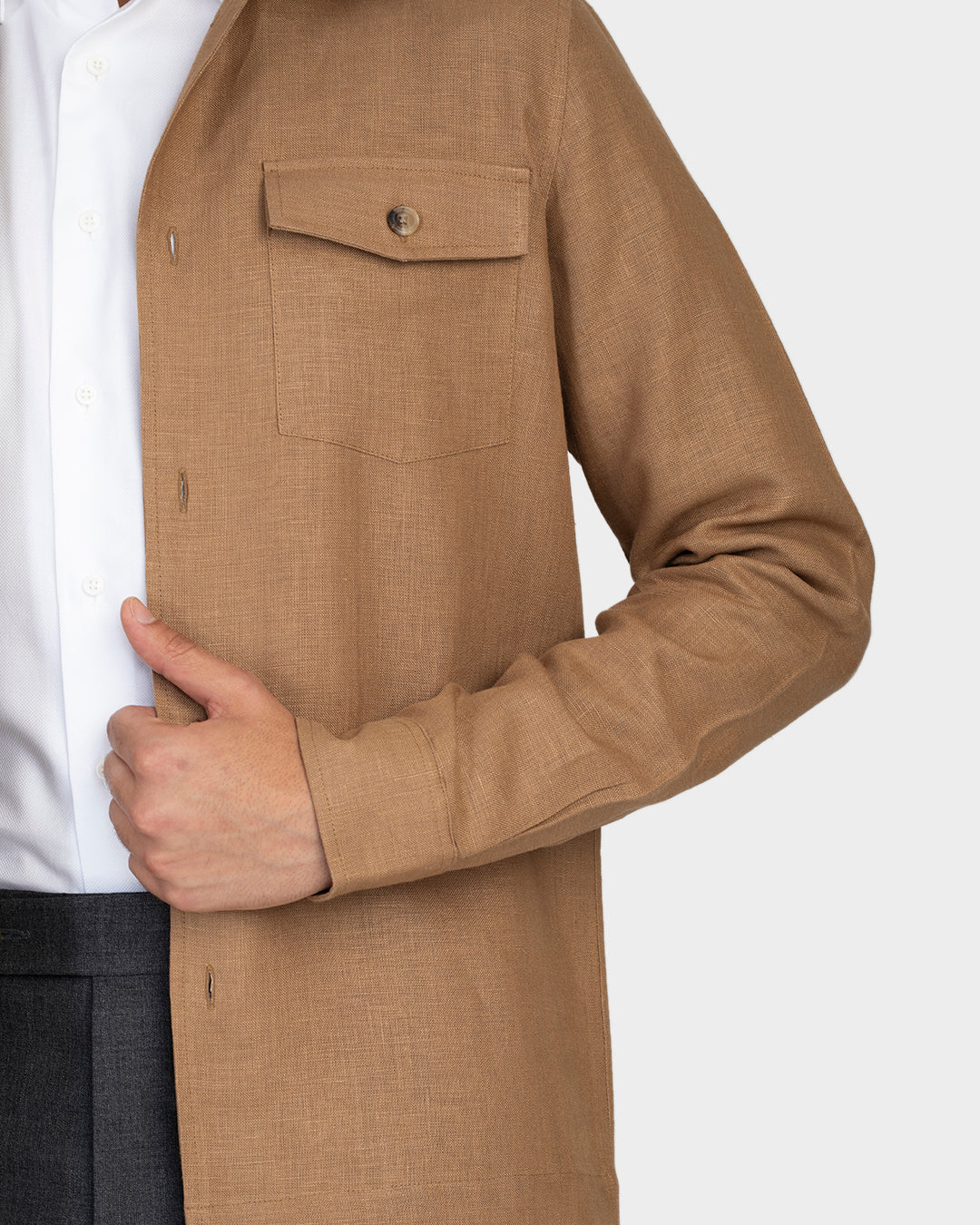 Close up of model wearing the linen shirt jacket for men by Luxire in golden brown 2