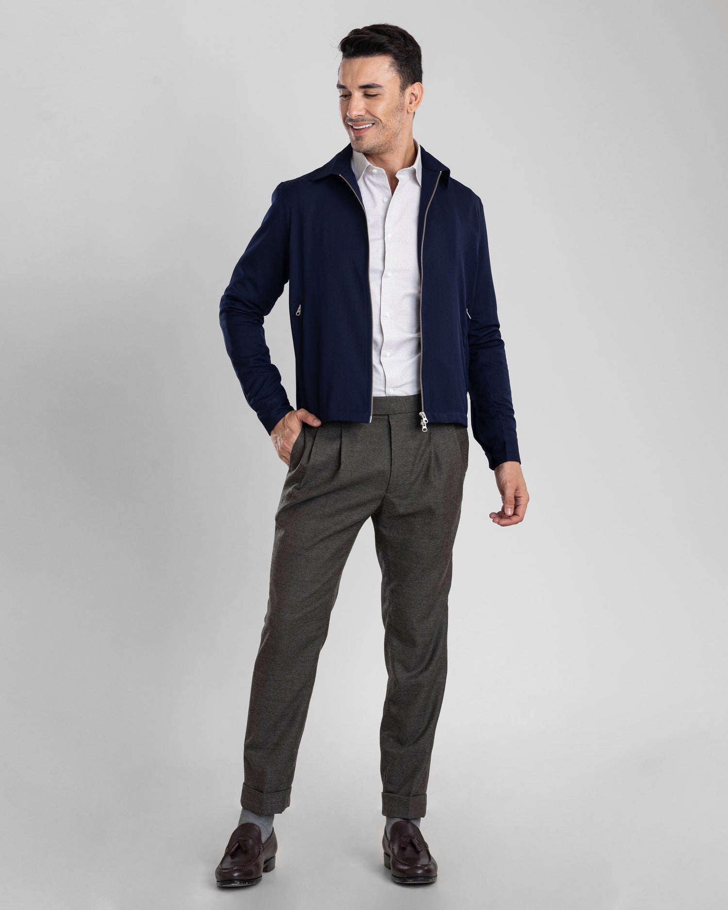 Front of model wearing the covert twill shirt jacket for men by Luxire in navy