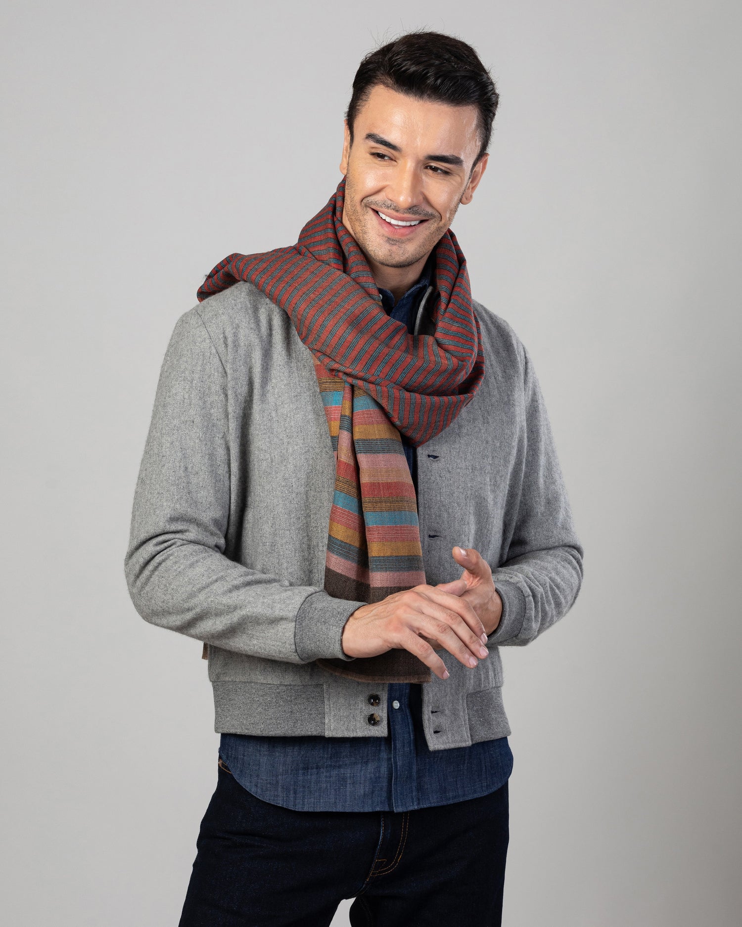 Model wearing the wool flannel shirt jacket for men by Luxire in grey wearing a scarf